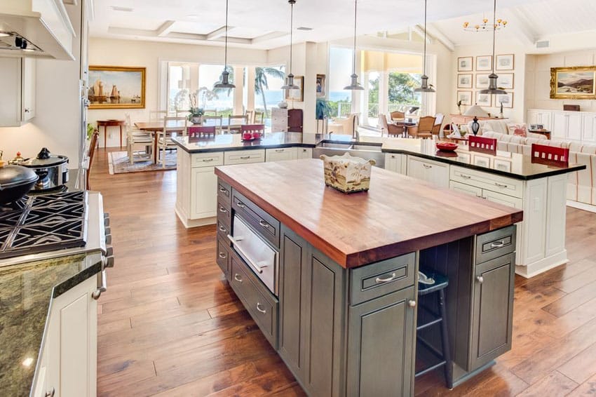 Country kitchen with wood counter island and granite breakfast bar island