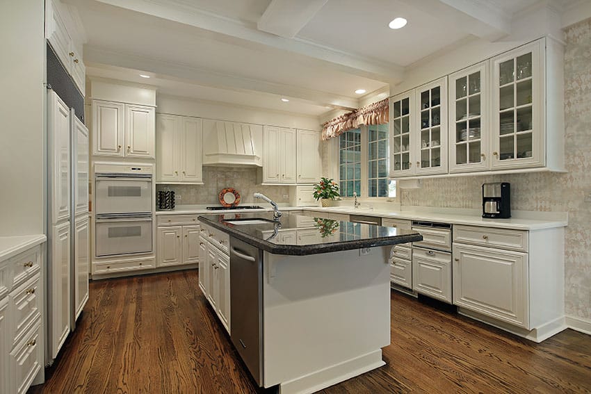 Cream cabinet kitchen with u shape design and dark counter island