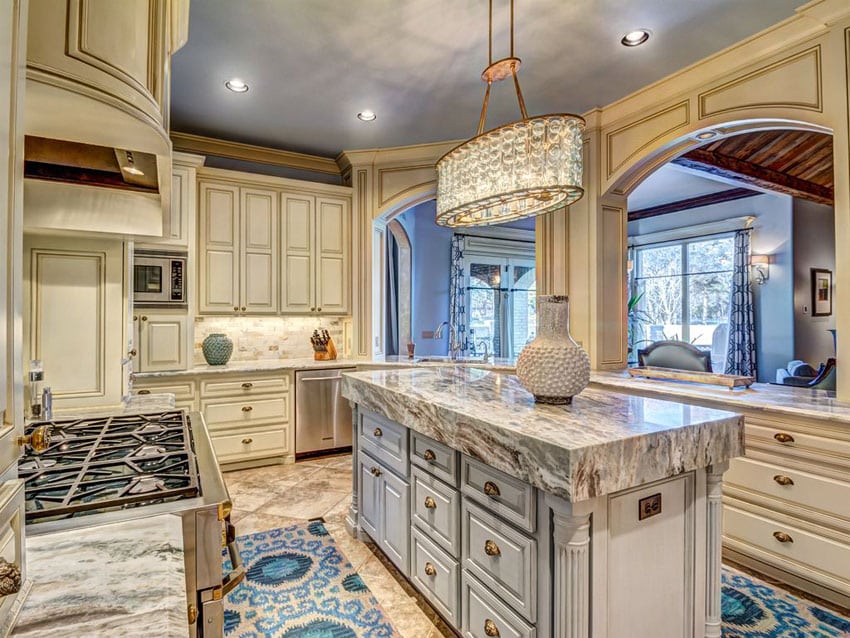 Cream cabinet traditional kitchen with augusta white marble counter and narrow island