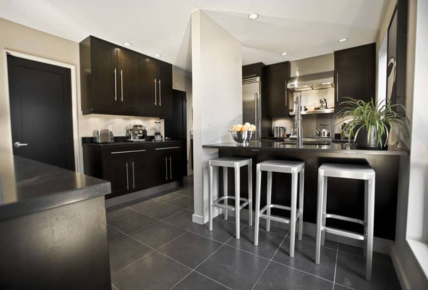 kitchen with solid surface counter and porcelain floor tiles