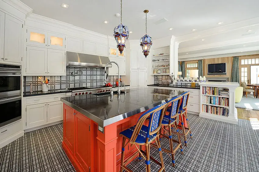 Eclectic kitchen with wood island with stainless steel counter and rattan bar stools
