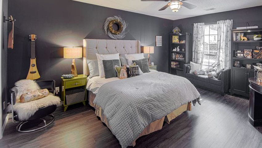 Eclectic master bedroom with black walls