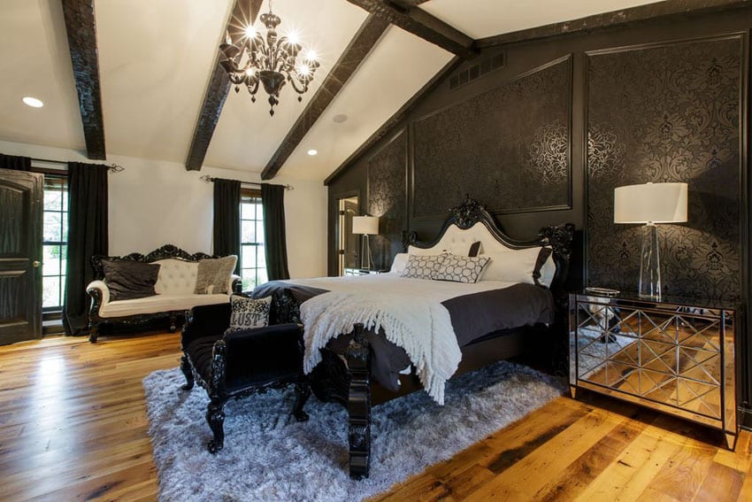 Elegant traditional bedroom with black patterned wall and chandelier