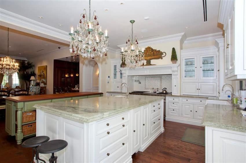 Elegant white cabinet kitchen with persian green marble counter island and green painted island with wood counter