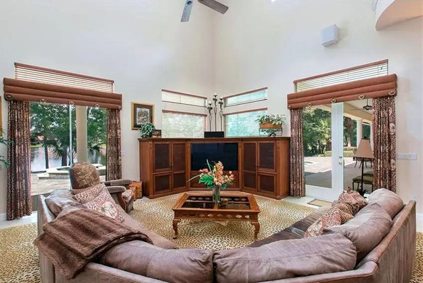 Family room with large couch and views to lake