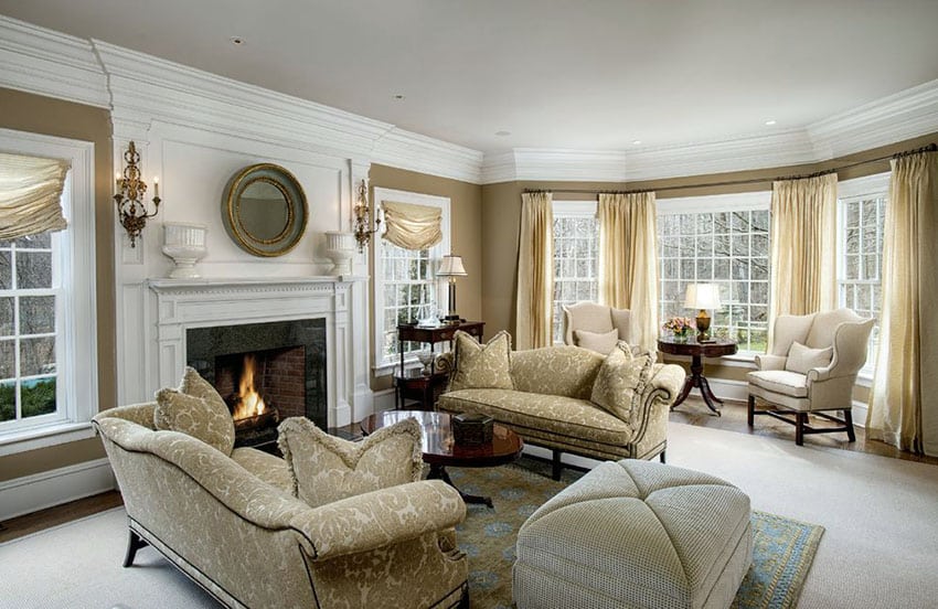 Formal living room with beige furniture fireplace and bay window