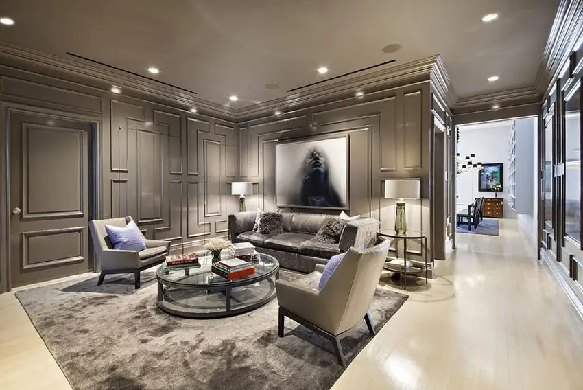 Formal living room with gray walls and wide plank wood flooring