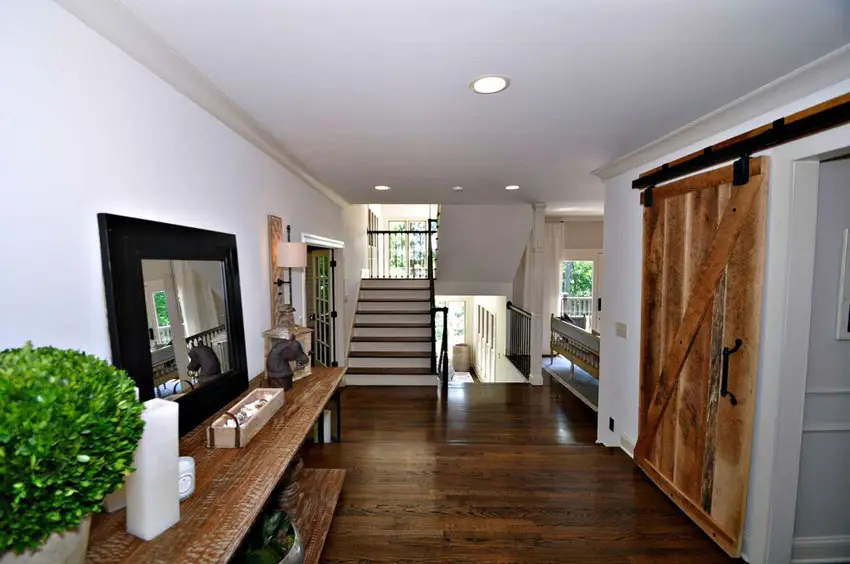 Home hallway with reclaimed wood sliding barn door