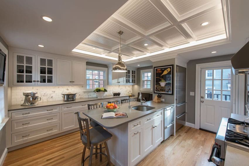 Kitchen with center peninsula and ash gray quartz 