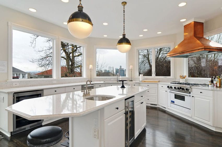 Kitchen with wrap around window views, white cabinets, marble counters and darkened hickory floors