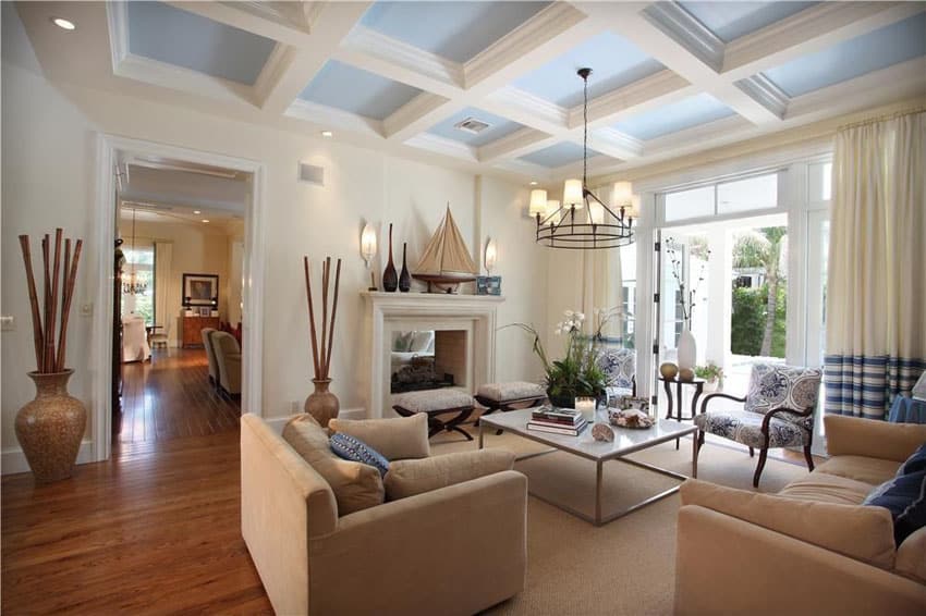 Lovely living room with blue box ceiling and wood flooring