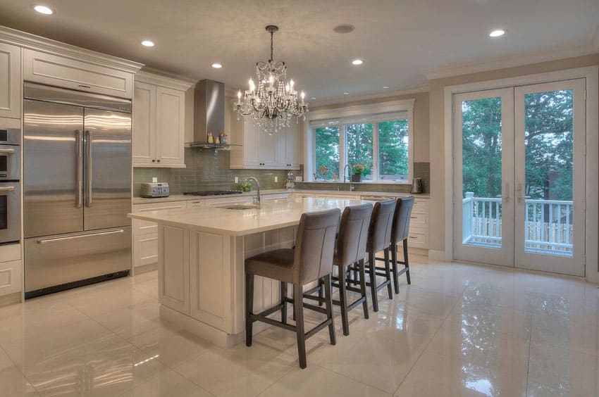 Luxury kitchen with cream cabinets, marble counter island with marble flooring