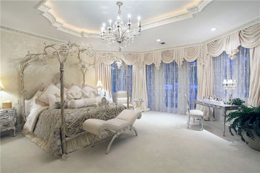 Luxury bedroom with canopy bed, Victorian style furniture and chandelier