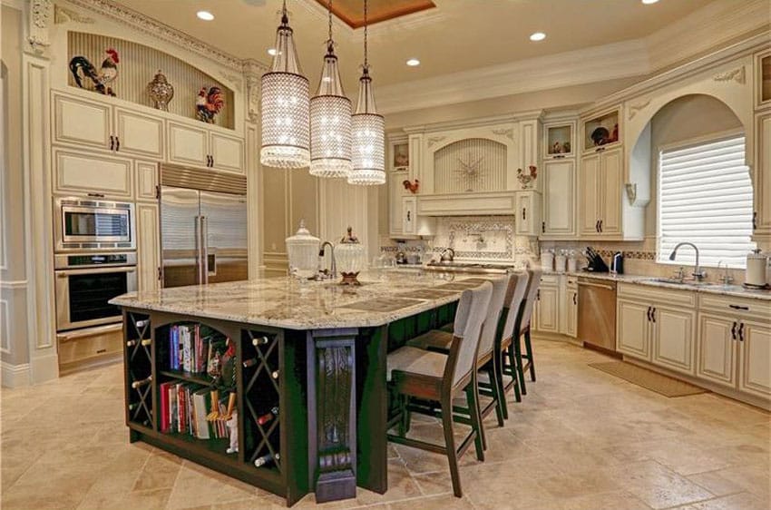 Kitchen with green breakfast bar island and honed travertine floors