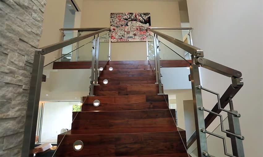 Luxury custom wood staircase with built in step lights stainless steel railings and glass enclosure