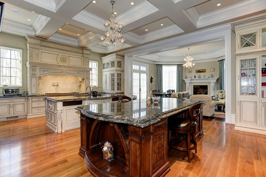 Luxury kitchen with decorative wood island with breakfast bar and pental kozmus satin granite counter