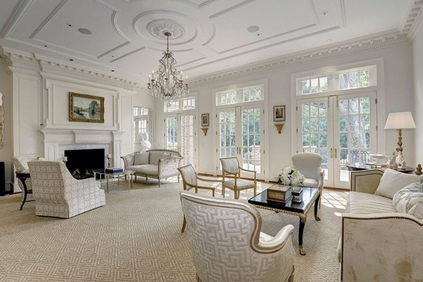 Luxury living room with Hampton design, fireplace, chandelier and Louis xvi armchairs