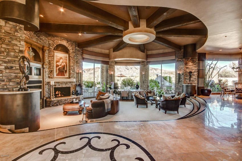 Luxury living room with large layout and spoke wood beam ceiling