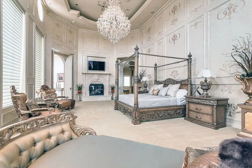 Bedroom with gilded bed, high ceilings and crystal chandelier