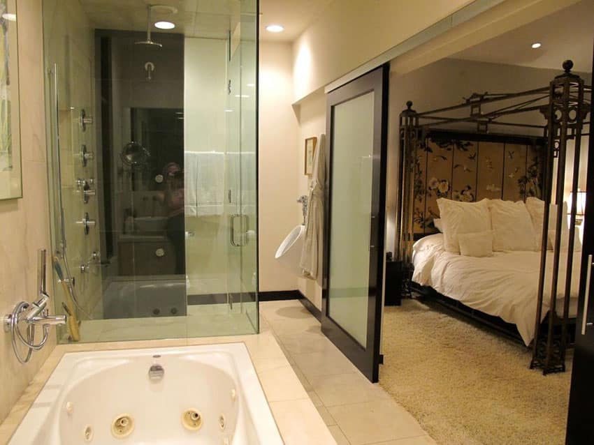 Master bathroom with modern sliding barn door with frosted privacy glass