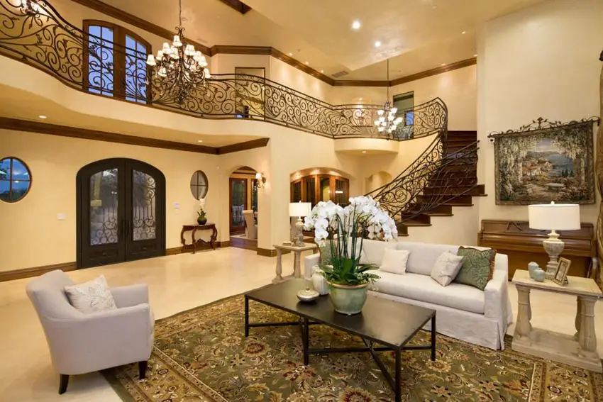 Mediterranean living room with grand staircase