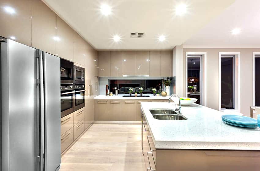 Modern kitchen with beige acrylic cabinets and white quartz countertops