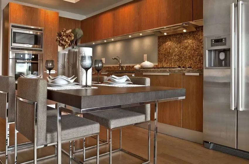 Modern kitchen with brown cabinetry and small dining table
