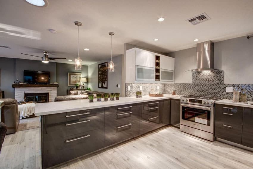 Modern kitchen with snow white quartz counter long peninsula and white oak floors