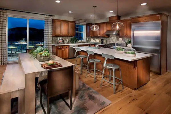 White center island, gray stool chair and long dinner table