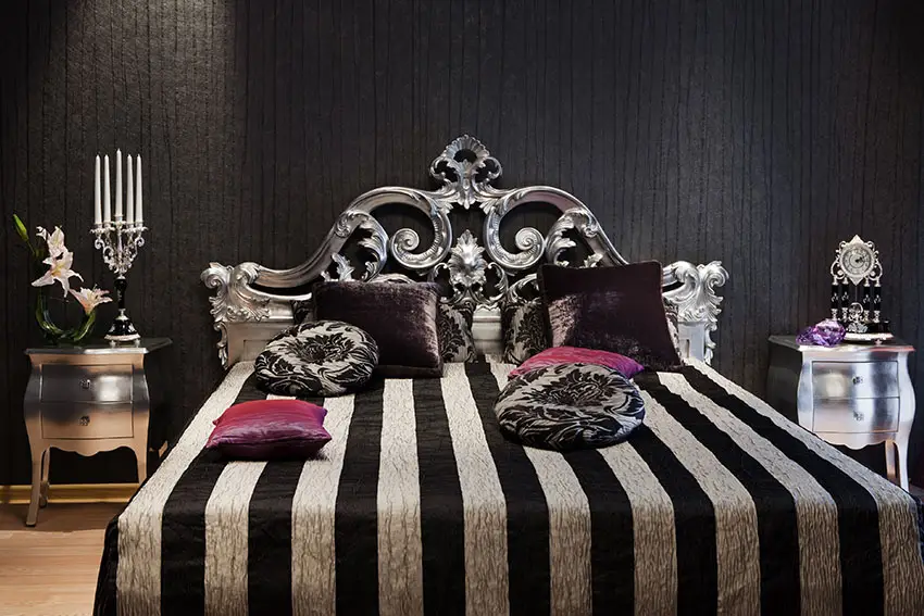 Romantic black bedroom with silver gilded bed frame and silver night stands