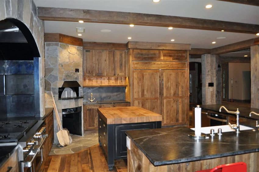 Kitchen with stone oven, soapstone counters and ceramic sink