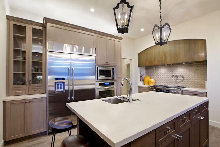 kitchen-with-beige cabinets dark wood island-and-bora-bora-beige-quartz