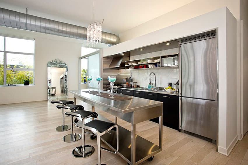Small one wall modern kitchen with rolling stainless steel island