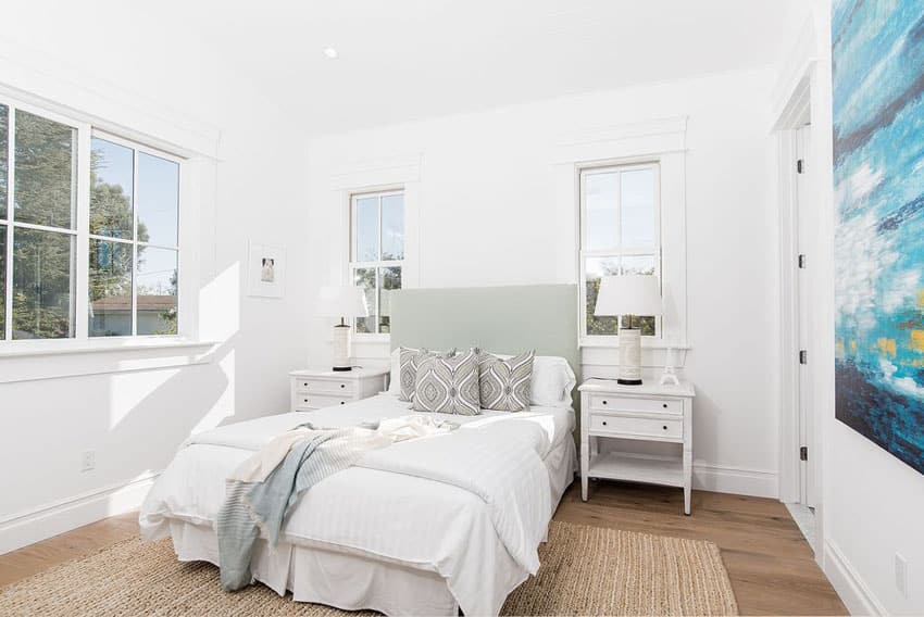 Traditional French style bedroom with blue wall art