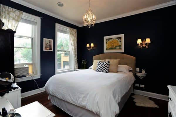 Traditional Bedroom With Dark Walls White Molding And Mini Chandelier 600x399 