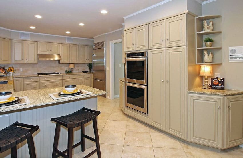 Cream colored cabinets with white appliances