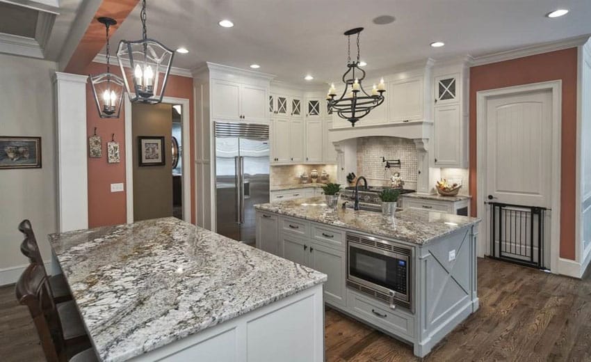 Traditional kitchen with avalon white granite, two islands for food preparation and dining and sink and microwave