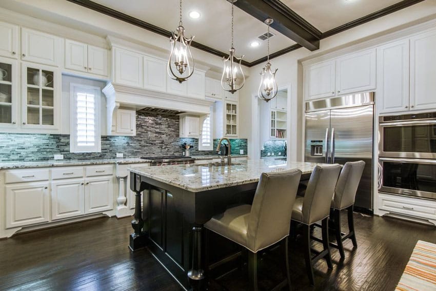 Traditional kitchen with blizzard granite topped island with breakfast bar seating