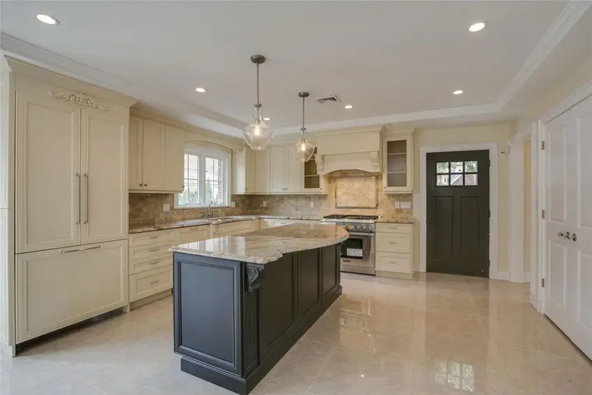 Kitchen with Calacatta gold marble, cream cornices and off white flooring