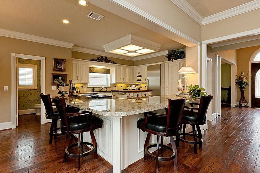 Traditional kitchen with l shaped peninsula and new venetian gold granite counter