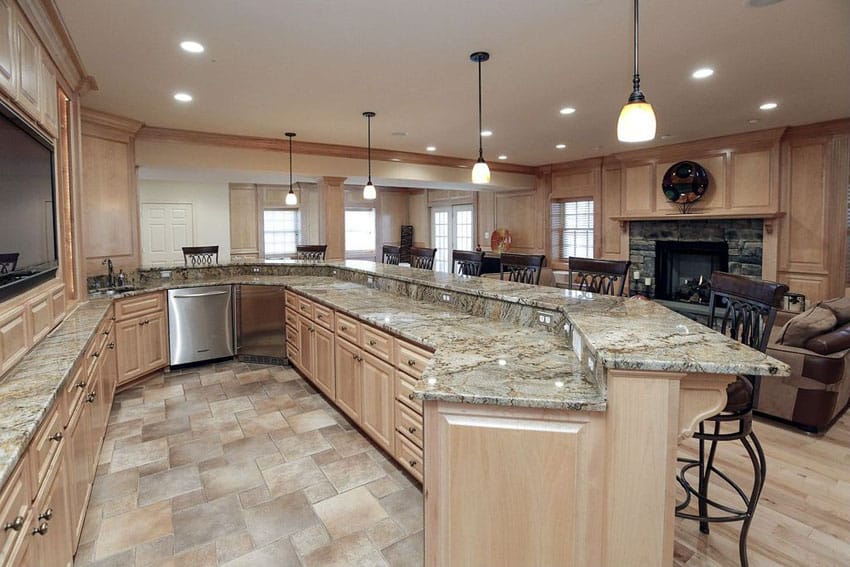 traditional kitchen with raised panel cabinets in light wood color with peninsula dining