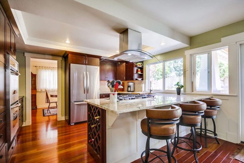 Traditional Kitchen With Santorini White Marble Counter Peninsula And Swivel Barstools With Cushions 