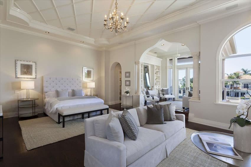 White fabric bed, sofa seat and chandelier