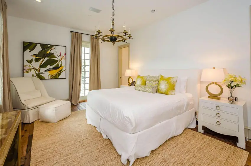 Bedroom with yellow accent decor and white furniture 