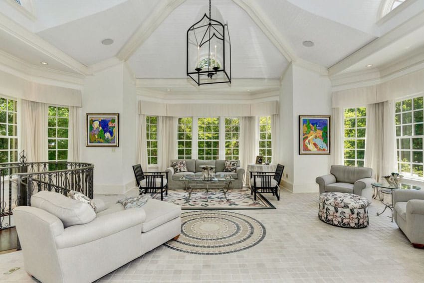 Traditional white living room with picture window views and vaulted ceiling