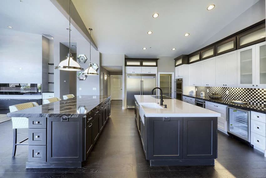 Transitional kitchen with two islands, flat panel cabinets and chessboard pattern backsplash