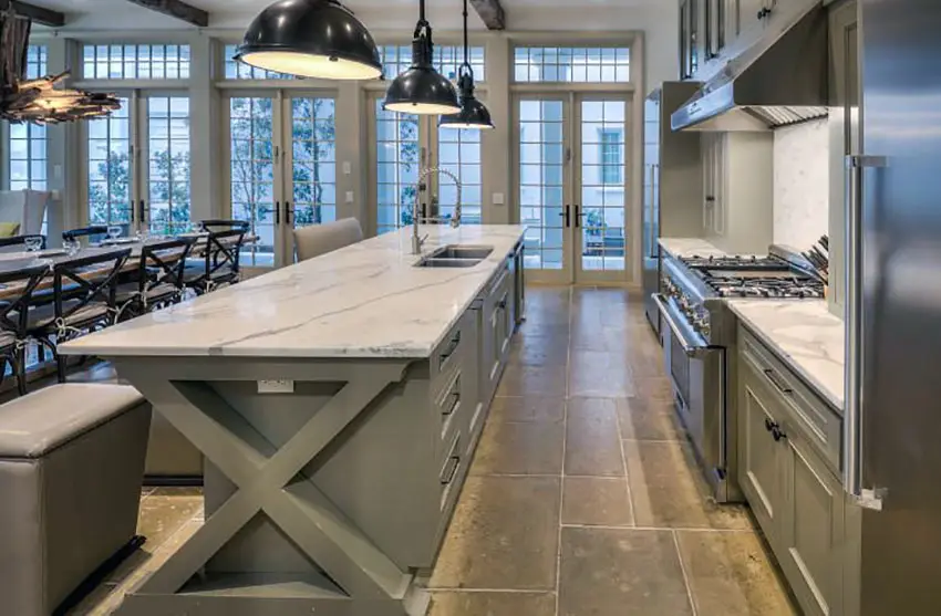 Transitional style kitchen with arabescato statuary marble counters, backsplash pendant lighting and open plan