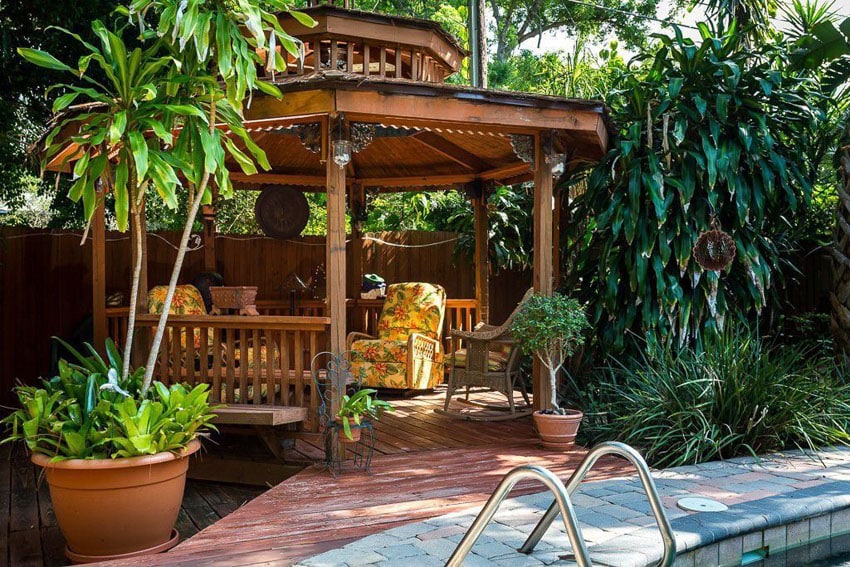 Tropical patio with cedar octagon gazebo 12 foot diameter next to pool