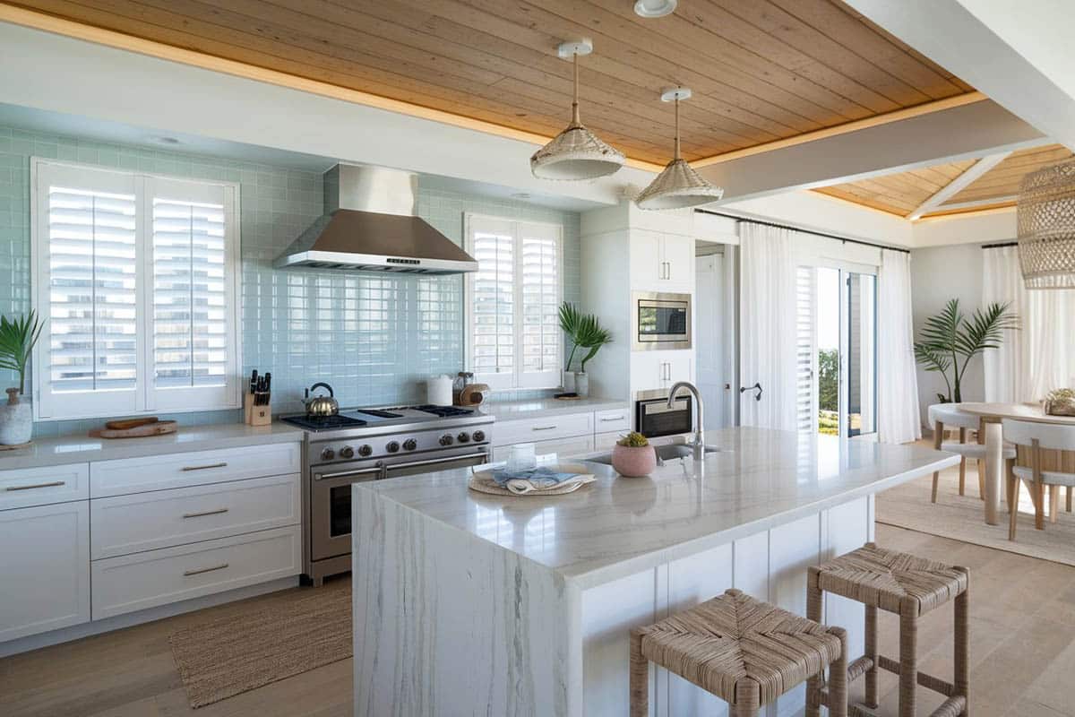 Kitchen with arctic white quartz counter and aqua glass backsplash