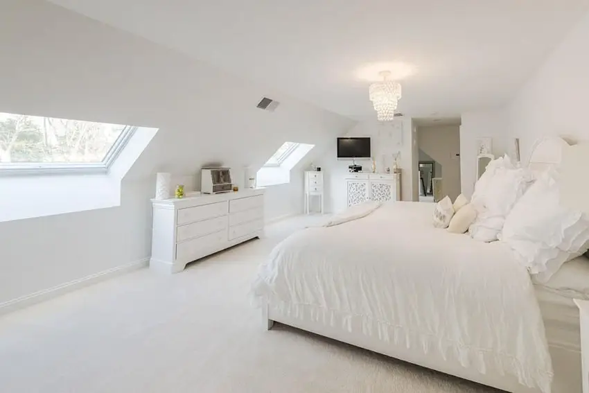 Upstairs attic bedroom with all white color theme 